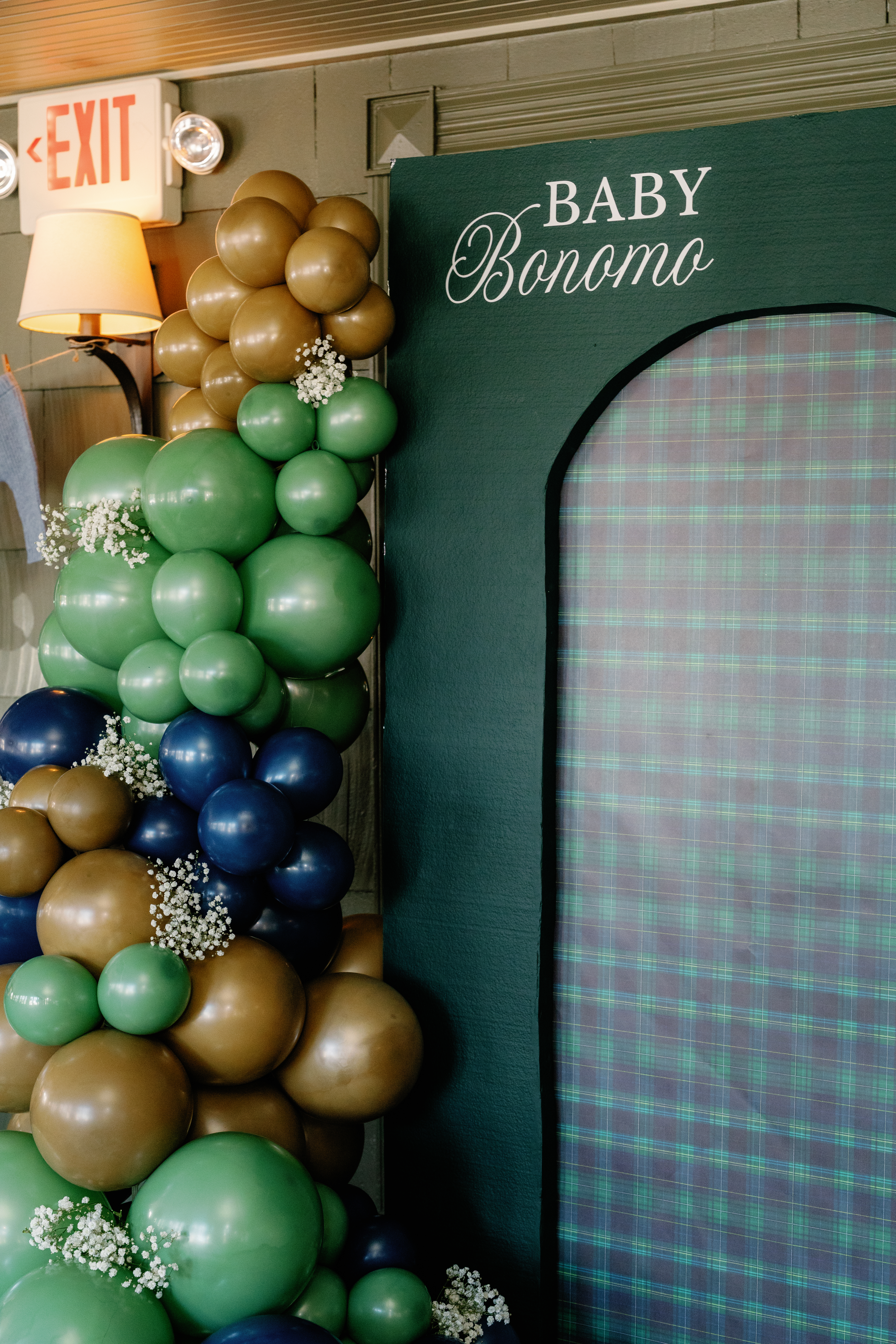 Closeup of styled floral and balloon backdrop for a celebration