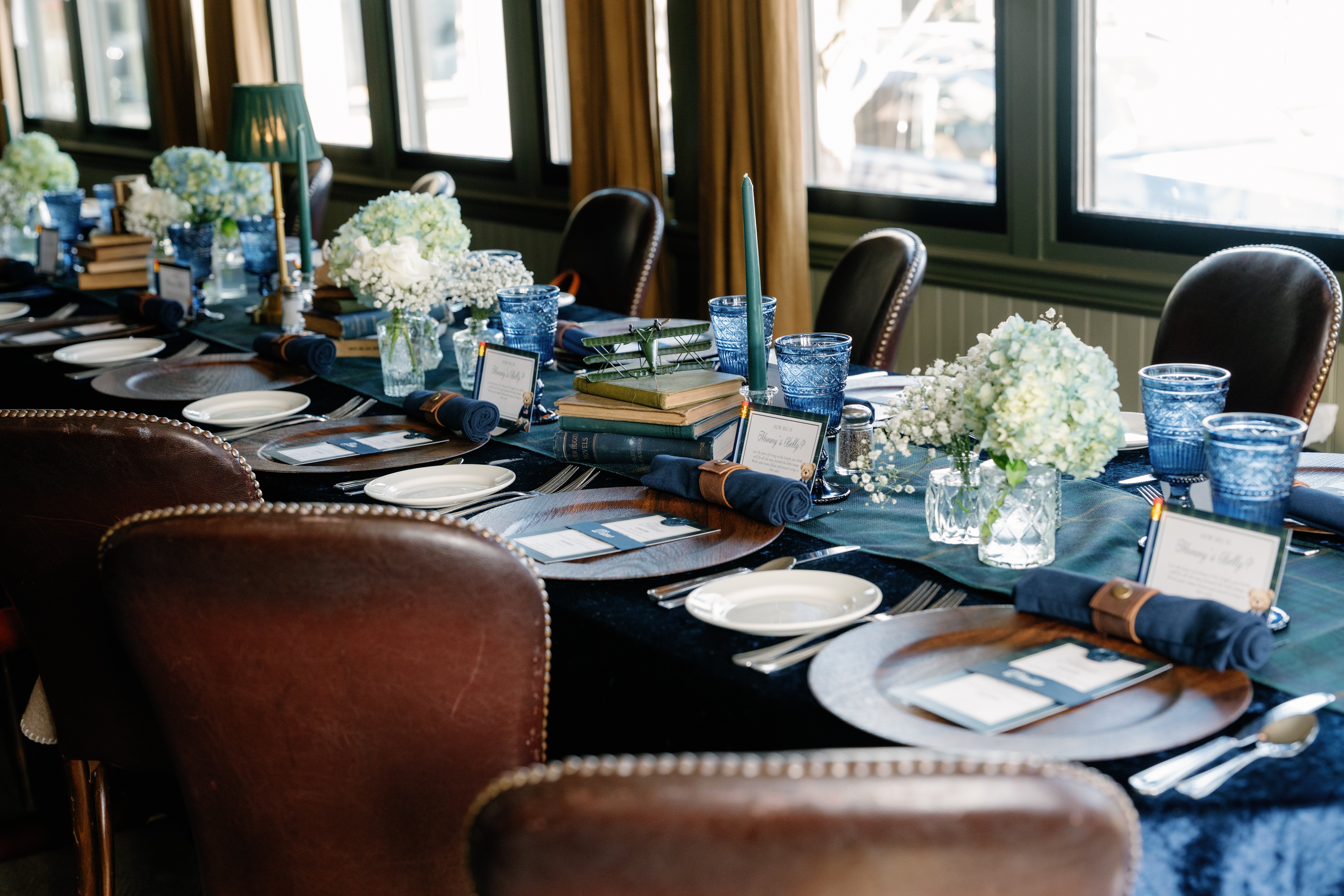 Beautifully styled long table setup in a decorated event venue